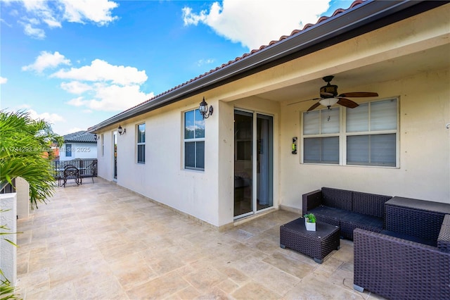 view of patio with outdoor lounge area and ceiling fan