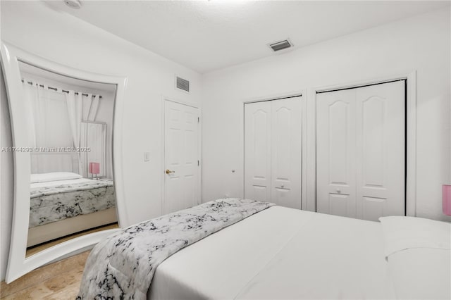 bedroom featuring two closets