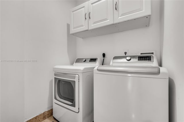 laundry area with cabinets and washer and dryer