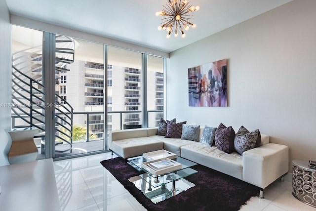 living room with a notable chandelier, a wall of windows, and light tile patterned flooring