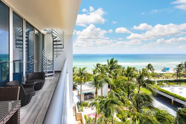 balcony featuring a water view