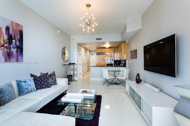 tiled living room with a chandelier