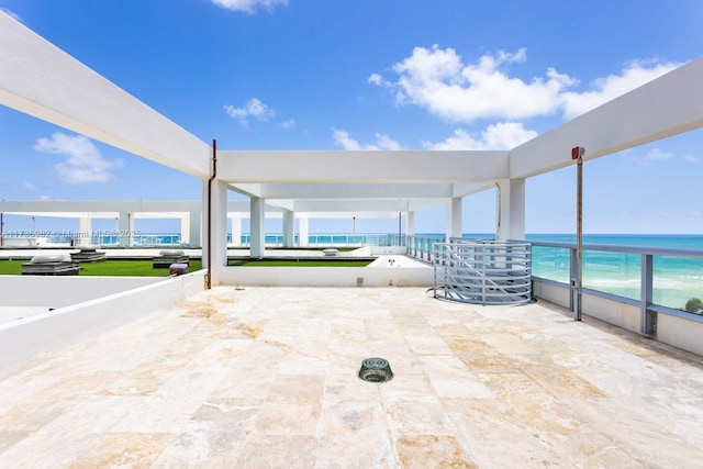 view of patio with a water view