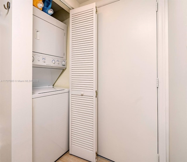 washroom with stacked washer / dryer