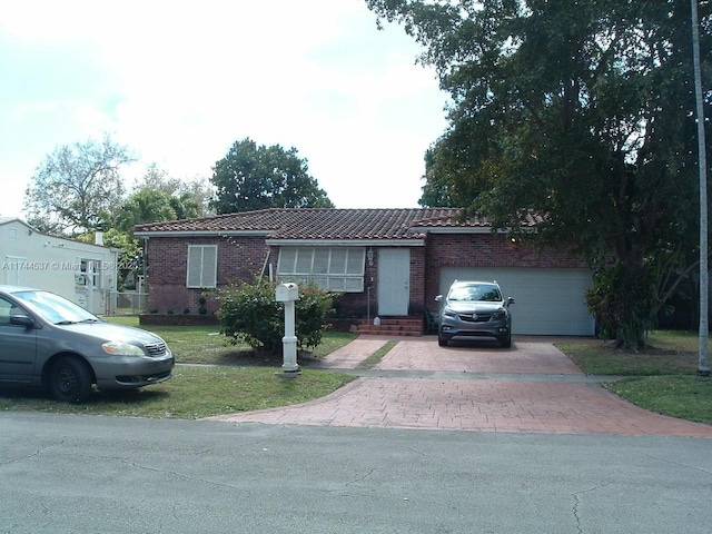 ranch-style home featuring a garage