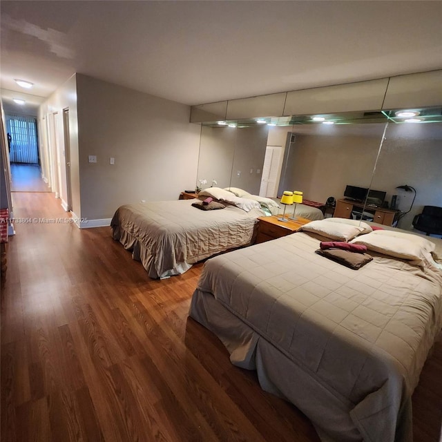 bedroom with hardwood / wood-style flooring