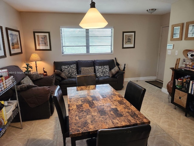 dining space with light tile patterned floors