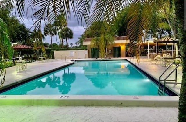 view of pool with a gazebo and a patio