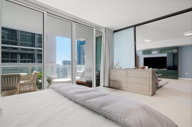 bedroom with access to outside and expansive windows