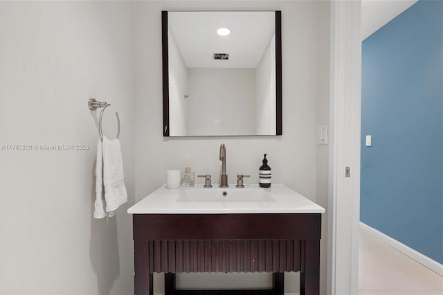 bathroom with vanity and tile patterned flooring