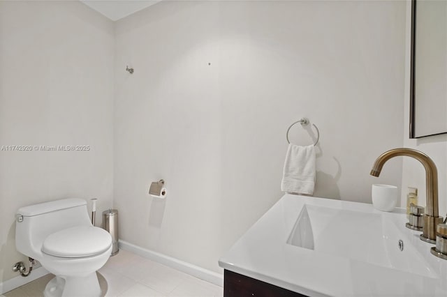 bathroom featuring tile patterned floors, toilet, and vanity