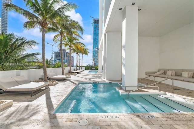 view of pool featuring a patio and outdoor lounge area