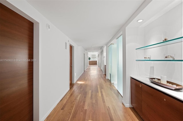 corridor featuring light hardwood / wood-style floors