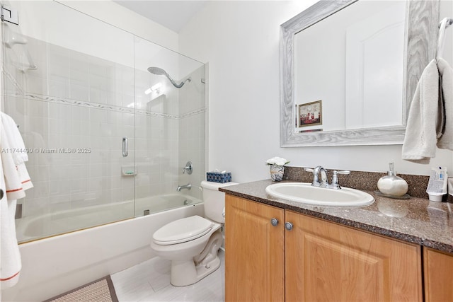 full bathroom with vanity, shower / bath combination with glass door, and toilet