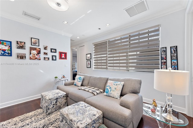 living room featuring hardwood / wood-style flooring and ornamental molding