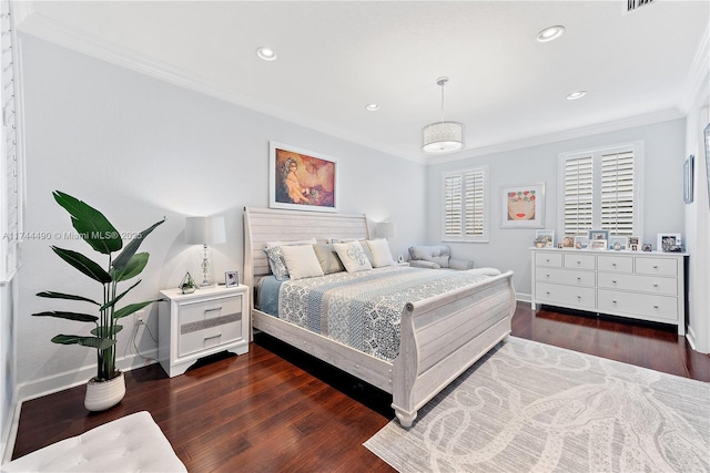 bedroom featuring crown molding and dark wood-type flooring