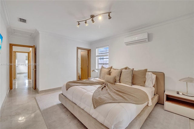 bedroom with crown molding, an AC wall unit, and track lighting