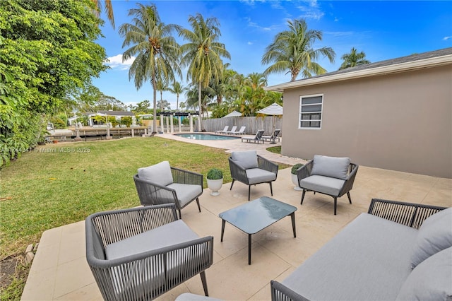 view of patio / terrace with an outdoor hangout area and a fenced in pool