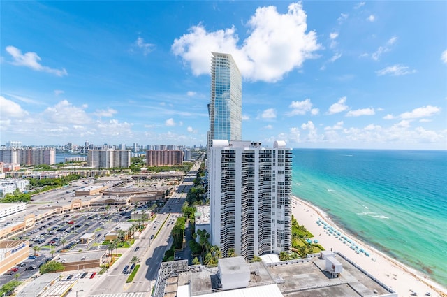 aerial view featuring a view of the beach and a water view