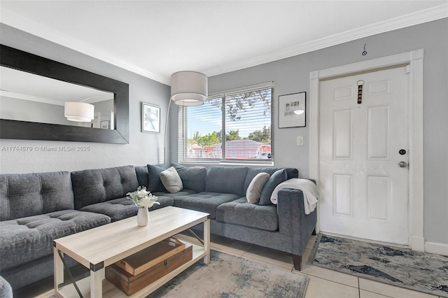 living room with ornamental molding and light tile patterned floors