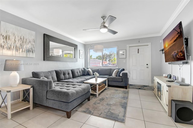 tiled living room with ceiling fan and ornamental molding