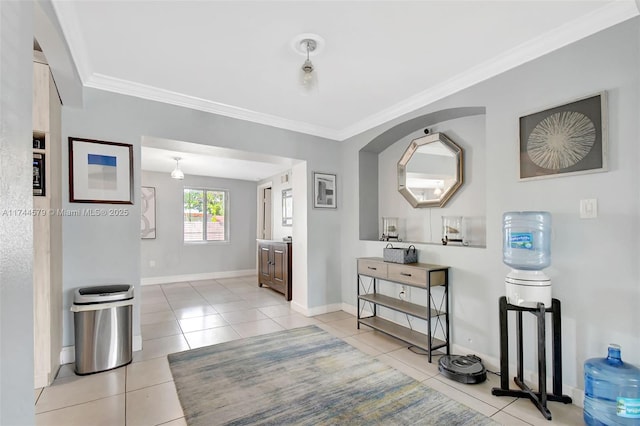 corridor with crown molding and light tile patterned floors