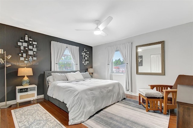 bedroom featuring ceiling fan and wood-type flooring