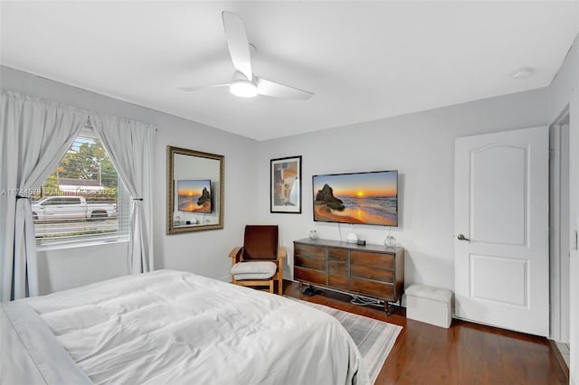 bedroom featuring ceiling fan and dark hardwood / wood-style flooring