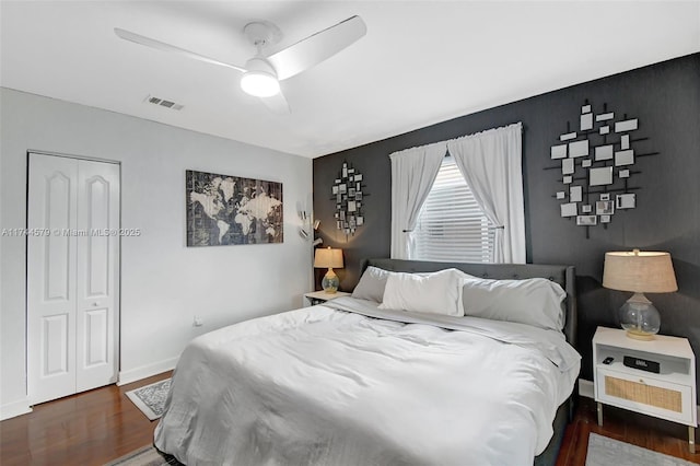 bedroom featuring dark wood-type flooring and ceiling fan