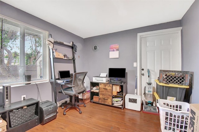 office area with wood-type flooring