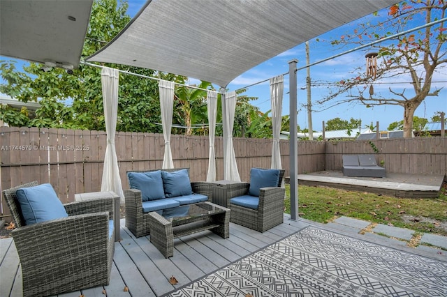 wooden deck with an outdoor living space