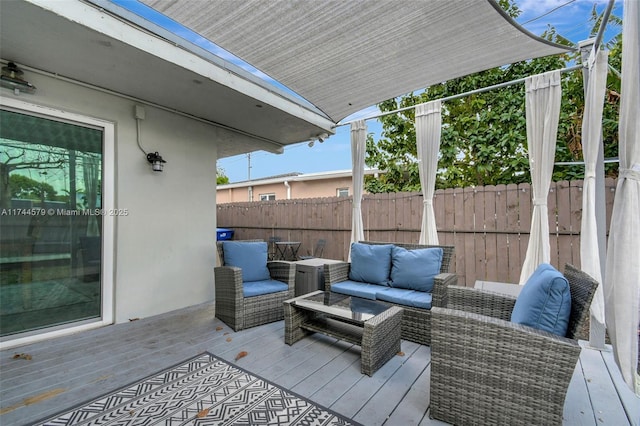 wooden deck featuring an outdoor living space