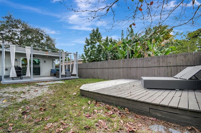 view of yard with a wooden deck