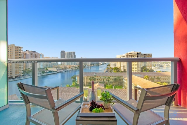 balcony featuring a water view