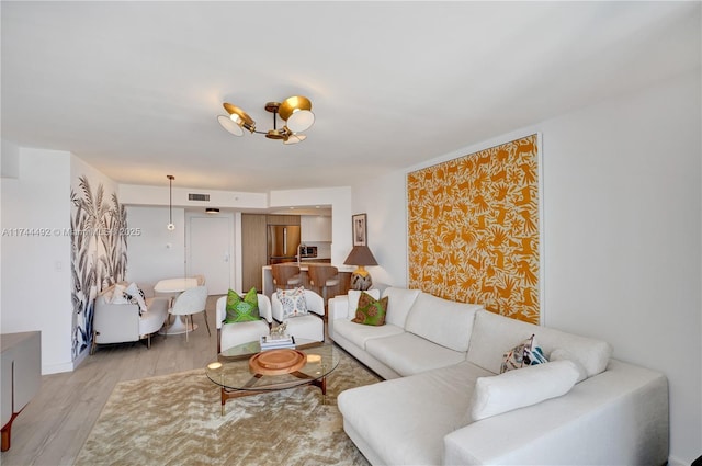 living room with light hardwood / wood-style flooring