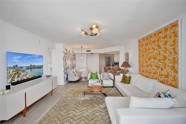 living room with light hardwood / wood-style flooring