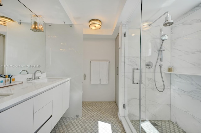 bathroom featuring vanity and a shower with door