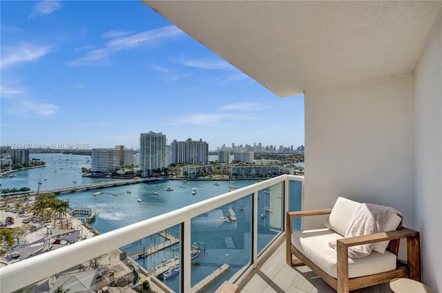 balcony featuring a water view