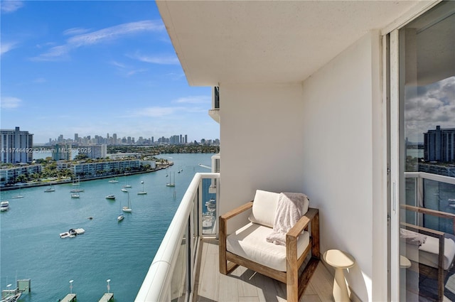 balcony featuring a water view