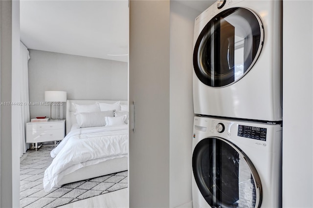 clothes washing area with stacked washer / drying machine