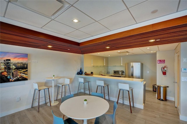 dining space featuring light wood-type flooring