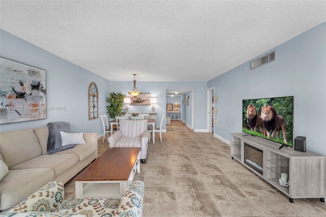 living room with a textured ceiling