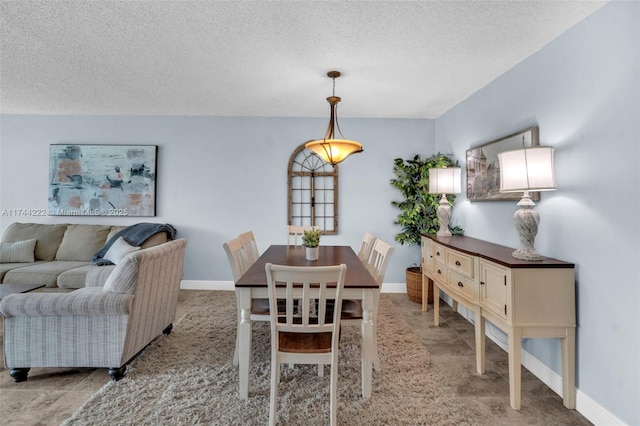 dining area with a textured ceiling