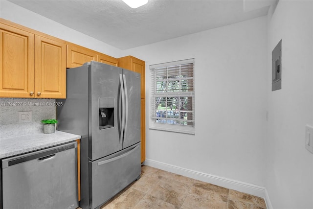 kitchen with tasteful backsplash, electric panel, and appliances with stainless steel finishes