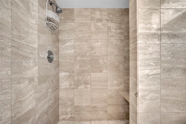 bathroom featuring a tile shower