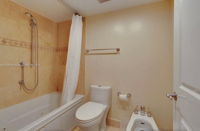 bathroom featuring shower / bathtub combination with curtain, toilet, and a bidet