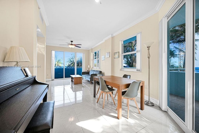 tiled dining room featuring crown molding and ceiling fan