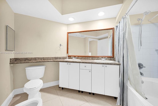 full bathroom featuring a bidet, vanity, shower / bath combination with curtain, tile patterned floors, and toilet