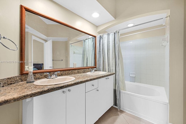 bathroom featuring shower / bath combination with curtain, vanity, and tile patterned flooring