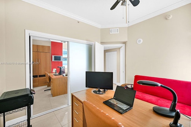 office space with light tile patterned floors, ornamental molding, and ceiling fan